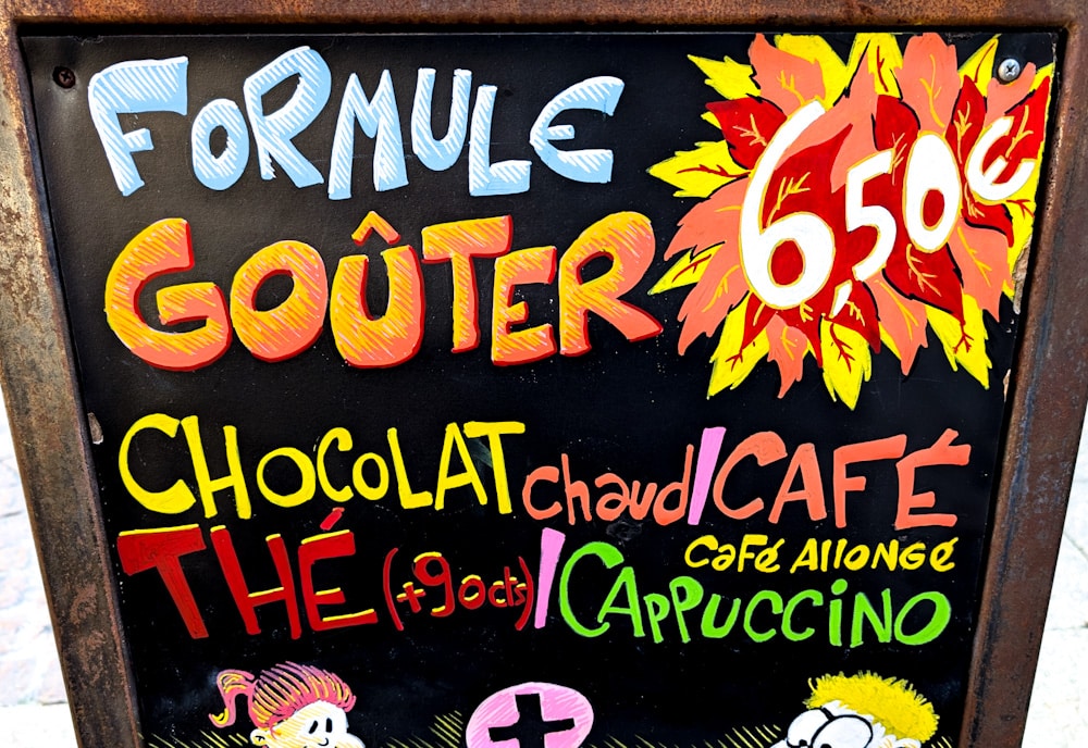 Enseigne peinte colorée pour une formule goûter avec une caricature d'enfant.